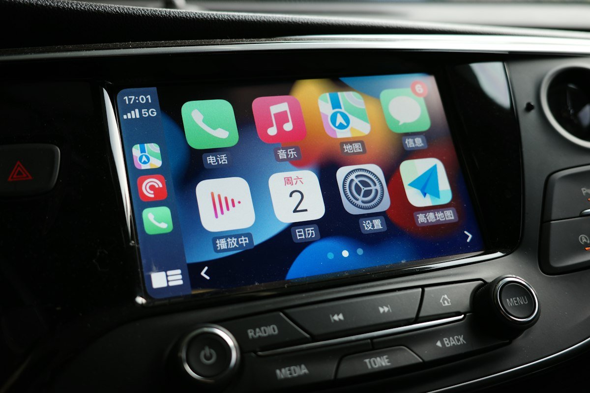 Modern vehicle touchscreen receiver displaying Apple CarPlay apps